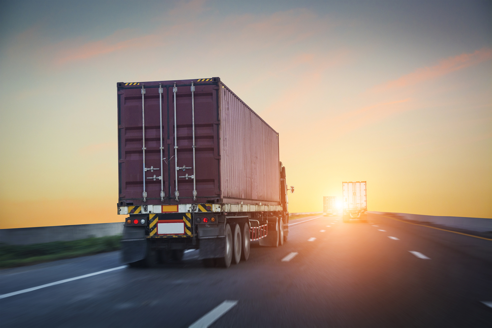 truck riding off into sunset