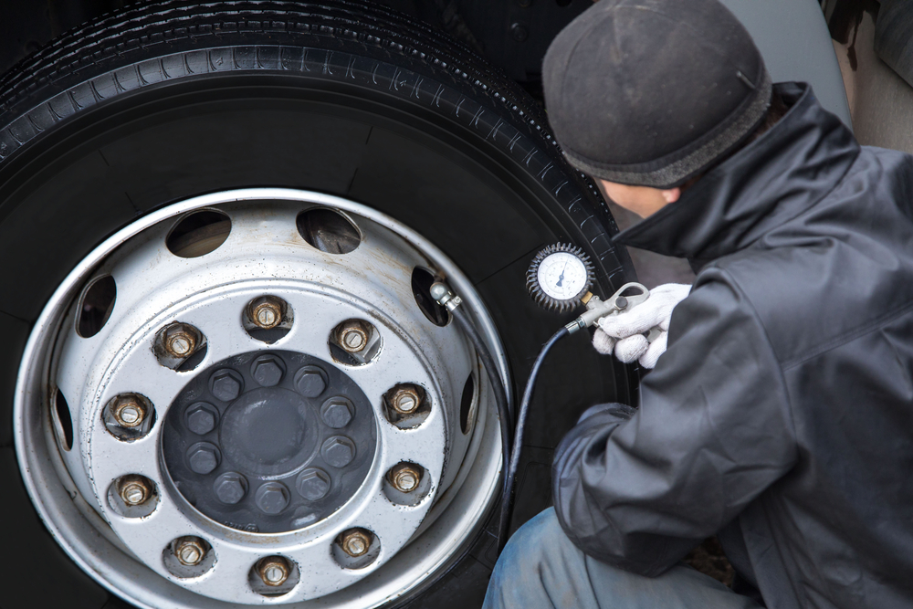 Man checking air in tire