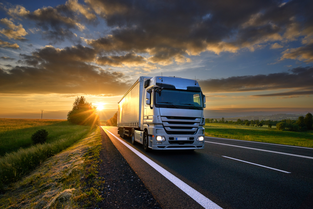 truck driving down country road